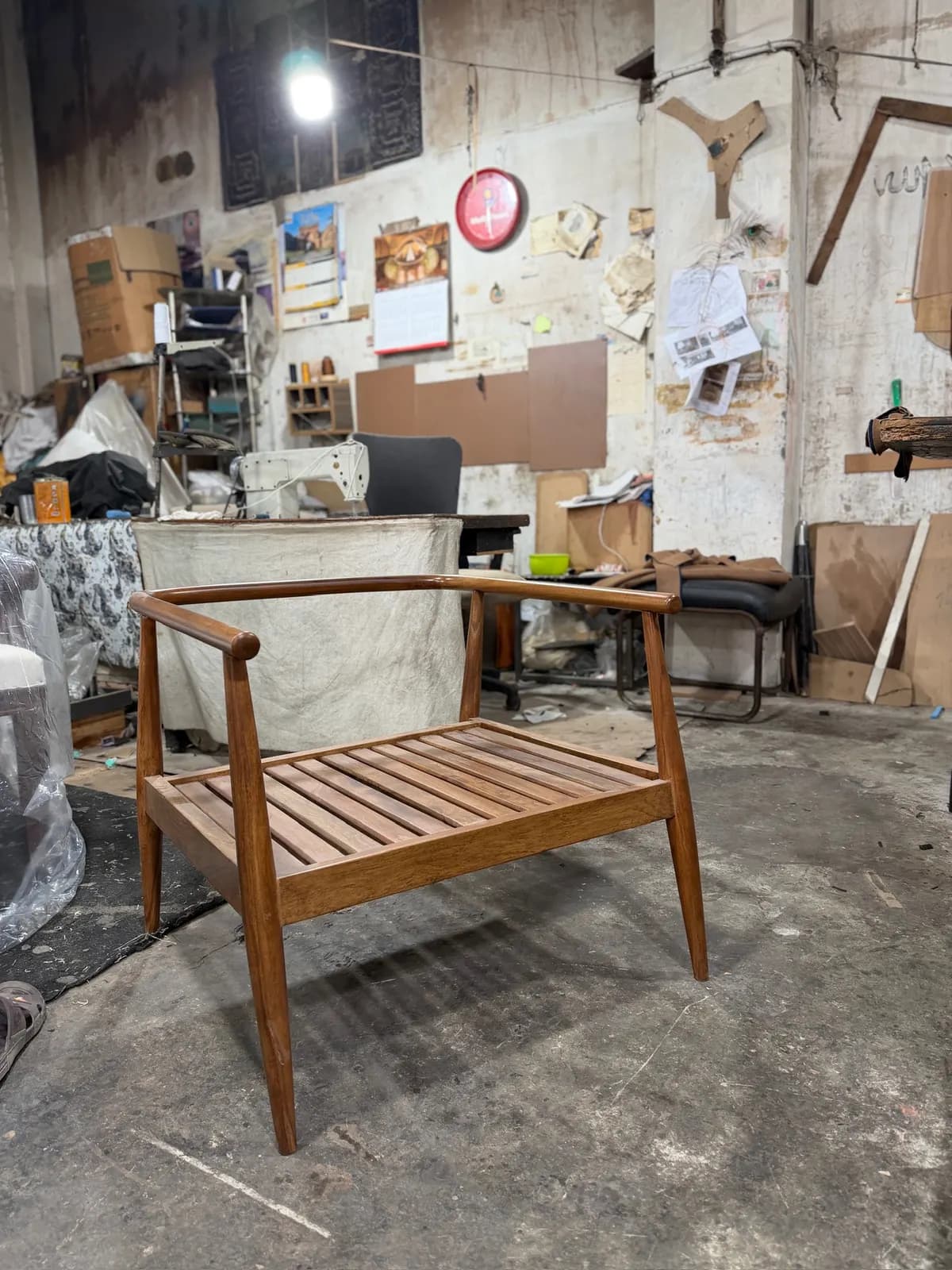 A completed frame of a lounge chair, awaiting upholstery
